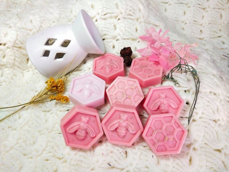 Wax melt on a ceramic warmer tray